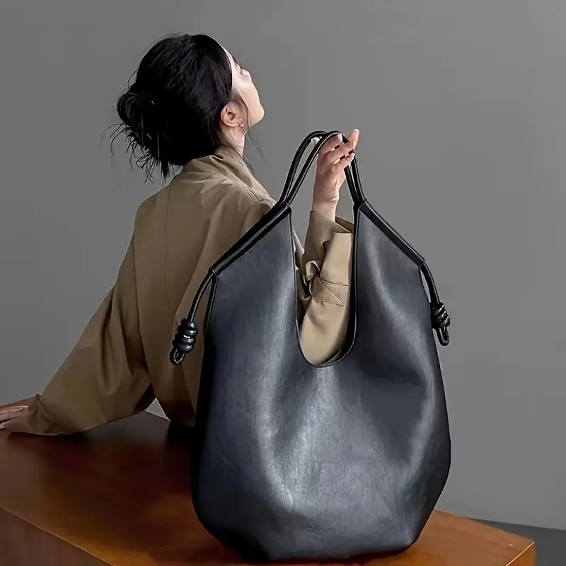 Clara is an elegant and spacious vegan leather tote bag.