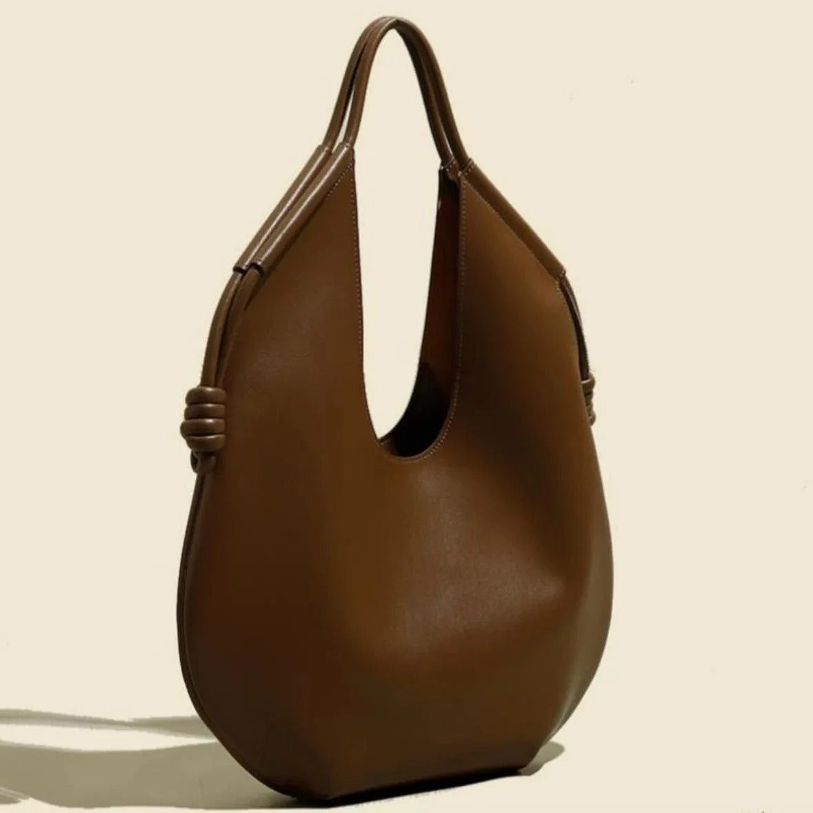 Clara is an elegant and spacious vegan leather tote bag.